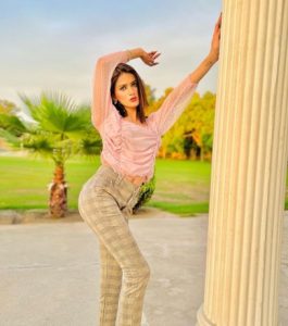 Model escort in white dress at Movenpick Hotel Karachi